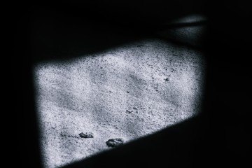 Abstract Minimal style black and whith rays of sunlight cast shadows on the Concrete floor