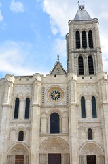 Fototapeta na wymiar Basilica of Saint-Denis or Basilique royale de Saint-Denis. Facade and bell tower. Paris, France.