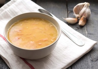 Pea soup in a bowl with garlic.