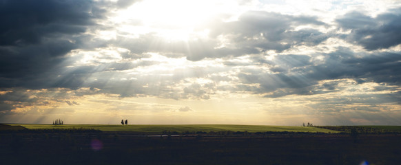 panorama sunset over the yellow hill . clouds over the river. textured clouds and beautiful...