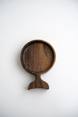 Round wood plate for food or snacks. Handmade hardwood new wooden cutting board isolated on white background. flat lay.