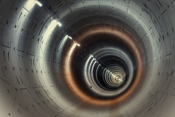 Construction of a new subway tunnel. Empty round tunnel with lighting