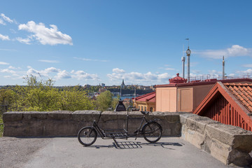 Fototapeta premium Terrass view over the district Södermalm with a old bike a sunny spring day in Stockholm