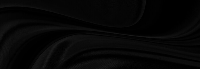 Black gray satin dark fabric texture luxurious shiny that is abstract silk cloth panorama background with patterns soft waves blur beautiful.