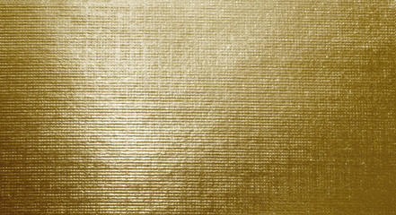 Golden foil background with rough geometric texture