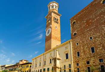 Torre dei Lamberti clock tower of Palazzo della Ragione palace building in Piazza Delle Erbe square...