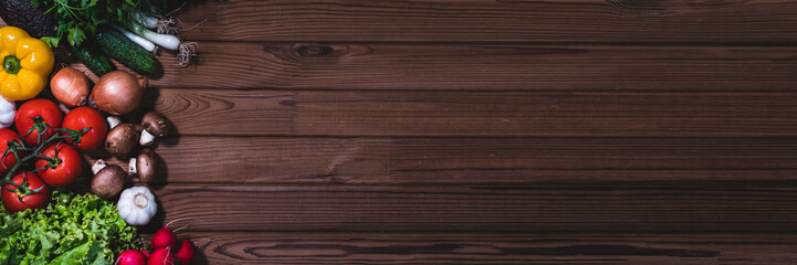 Banner from various vegetables and fruits isolated on dark background rustic table, top view, creative flat layout. Concept of healthy eating, food background. Frame of vegetables with space for text.