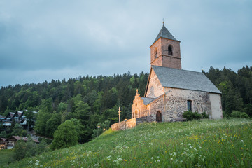 Fototapeta premium Alpine church of St. Kathrein in der Scharte - Santa Caterina (Saint Catherine) on the mountains, Hafling - Avelengo, South Tyrol, Italy, Europe
