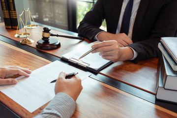Male Notary lawyer or judge consult or discussing contract papers with Businessman client in office, Law and Legal services concept.