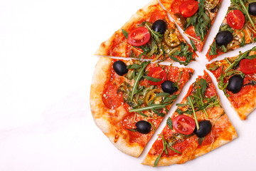 Italian pepperoni pizza pinza with olives and arugula