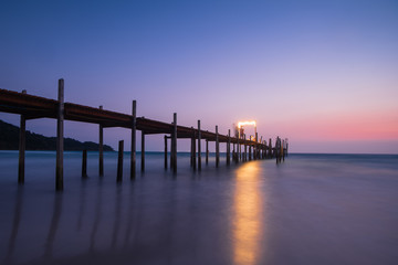Wood bridge on the sea with a beautiful sunset at koh kood island, Thailand