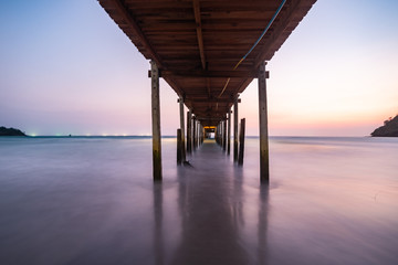 Wood bridge on the sea with a beautiful sunset at koh kood island, Thailand
