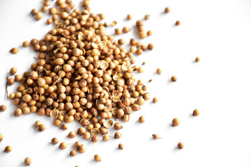 
Coriander seeds on a white background