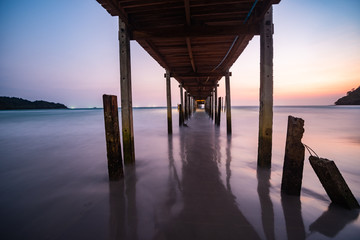 Wood bridge on the sea with a beautiful sunset at koh kood island, Thailand