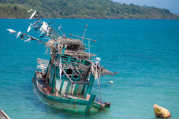 Drowning fishing boat in sea