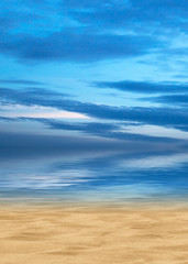 Bright blue sky with clouds against the horizon on the endless ocean, yellow sand