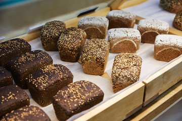 tasty homemade rectangular black bread with seeds