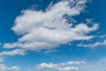 Obraz premium Beautiful blue sky and close-up white clouds. Nature background.