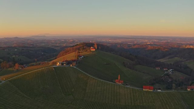 Aerial flight over South styria vineyards landscape, near Gamlitz, Austria, Eckberg, Europe. Grape hills view from wine road in spring. Tourist destination, travel spot.