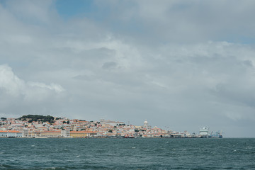 Lisbon panoramic view from the Tagus river (rio Tejo) during the cloudy day