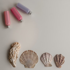 beach sea background layout with shells and colorful bottles for text.