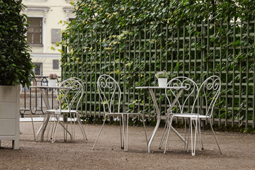 Empty cafe and white metal tables in the Park. Ban on visiting public places due to threat of coronavirus.