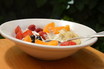 Healthy breakfast or snack curd with fruit and nuts. The concept of nutrition for weight loss. Keto breakfast. Keto lunch idea. cottage cheese or yogurt with berries on a window cup of coffee or tea