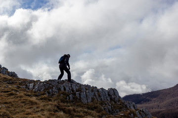 woman hiker on mountain peak