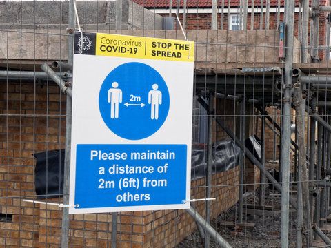 Covid 19 distance warning on a construction site