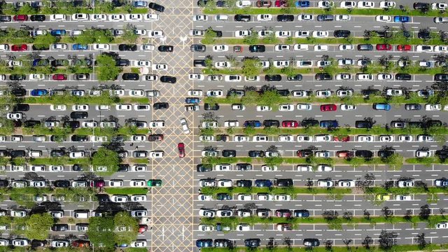 Top view of Linear Car Parking and Green Lines and People Walking.