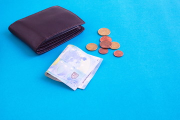 set of banknote, coins and wallet on blue background