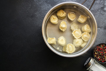 pasta tortellini with filling Menu concept healthy eating. food background top view copy space for text healthy eating table setting