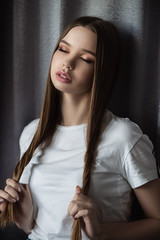 Portrait of a beautiful girl with closed eyes. Makeup. Glamor Fashionable photo. High quality photo. The young girl.