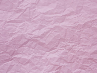 Pastel pink crumpled paper texture background