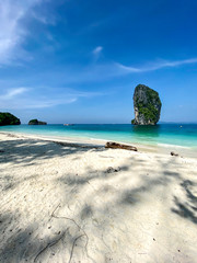 The white sand beach of Ko Poda island and the big rocks in the turquoise water surface, Krabi, Thailand