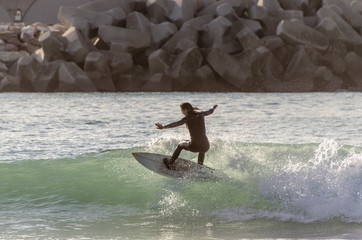 Surfer riding the waves of the sea