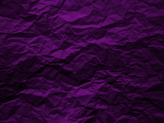 Crumpled dark purple paper texture background
