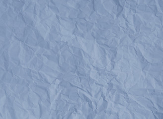 Crumpled pastel blue paper texture background