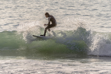 Surfer riding the waves of the sea