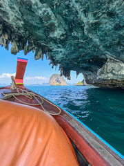 Sailing with a longtail private boat to Ko Poda island landscape with big rocks and turquoise water surface, Krabi, Thailand