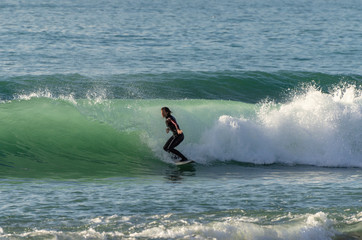 Surfer riding the waves of the sea