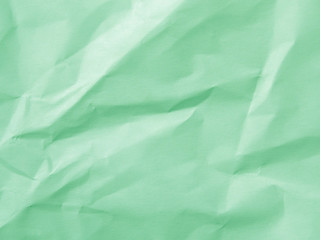Mint green crumpled paper texture background