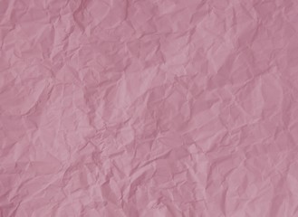 Crumpled pastel pink paper texture background