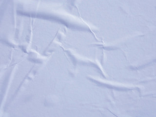 Light blue wet crumpled paper texture background