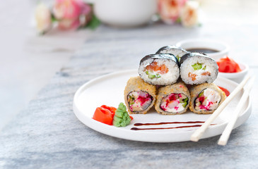 Sushi Rolls asian food stylish beautiful close up picture. Tasty delishes meals with rice and seafood on the white plate