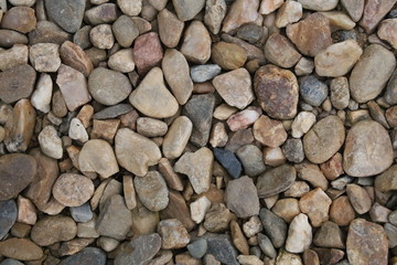 Multi colored stones on the ground.
