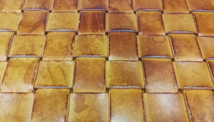 Background of strips of woven brown leather