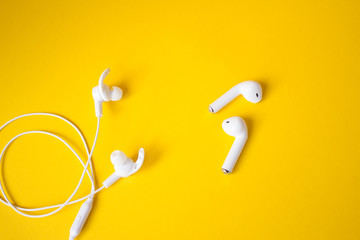 White headphones for talking and listening to music. Gadget and technology concept with copy space.