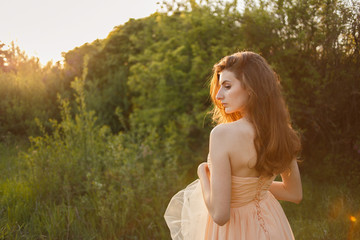 Fine Art Portrait of a beautiful bride in a summer garden