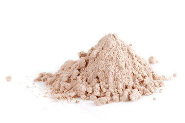 Small pile of brown substance looking like heroin isolated on white